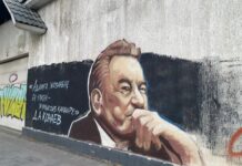 Дом-призрак в Шымкенте украсили граффити с Кунаевым Кунаев