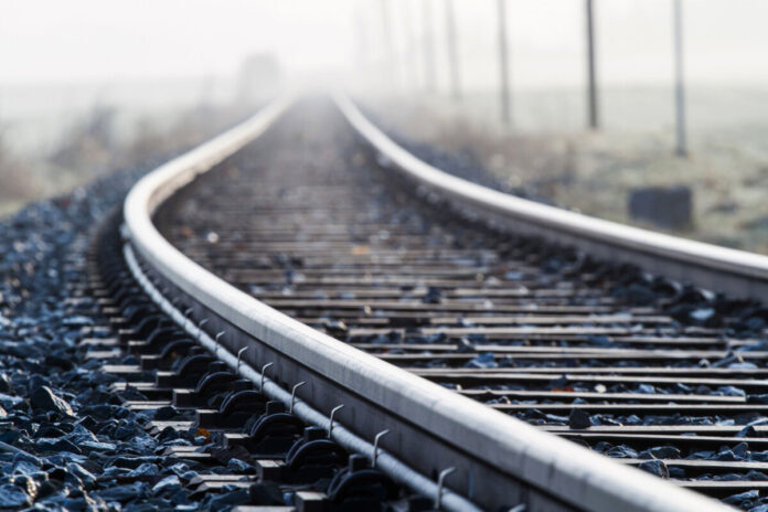 Railway line in morning fog in rural Bavaria, Germany